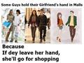 Guys Hold Hands In Shopping Mall