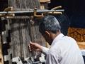 a men working on khadi at Lok Virsa Mela Islamabd