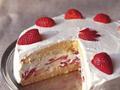 Carry cake with strawberries and whipped cream